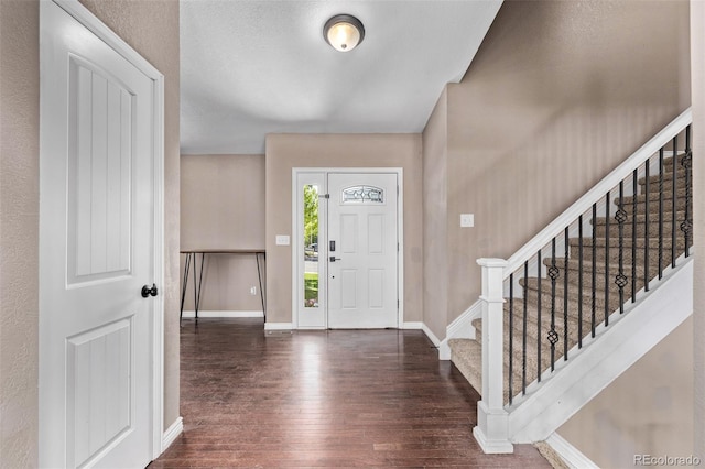 6062 S Newport St, Centennial, CO 80111 - entryway with wood finished floors, baseboards, and stairway