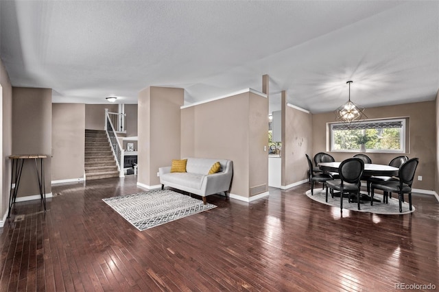 6062 S Newport St, Centennial, CO 80111 - dining area with stairs, baseboards, hardwood / wood-style floors, and a chandelier