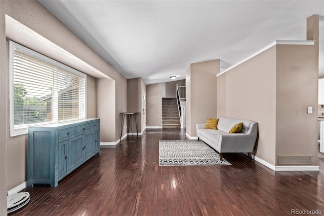 6062 S Newport St, Centennial, CO 80111 - living area featuring dark wood finished floors, baseboards, and stairway