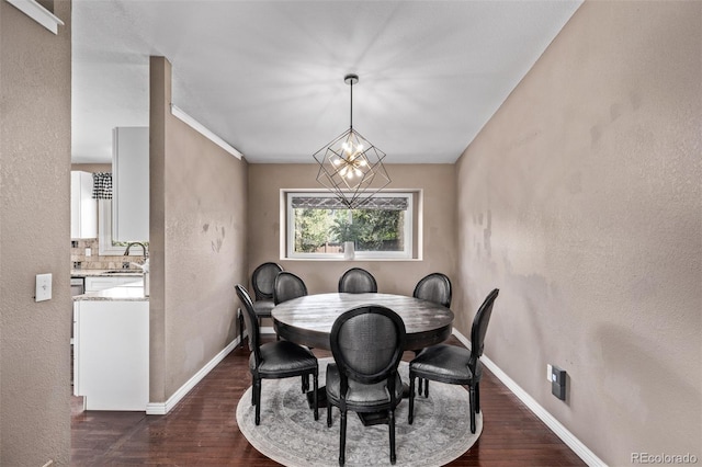 6062 S Newport St, Centennial, CO 80111 - dining space featuring dark wood-type flooring, baseboards, a chandelier, and a textured wall