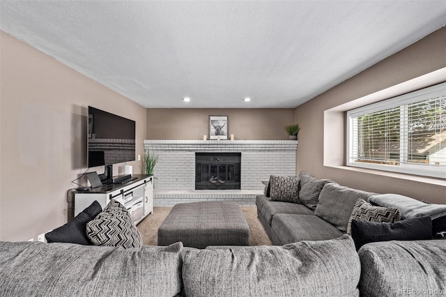 6062 S Newport St, Centennial, CO 80111 - living area with light carpet, a fireplace, and recessed lighting