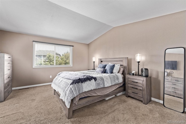 6062 S Newport St, Centennial, CO 80111 - bedroom with vaulted ceiling, light carpet, and baseboards