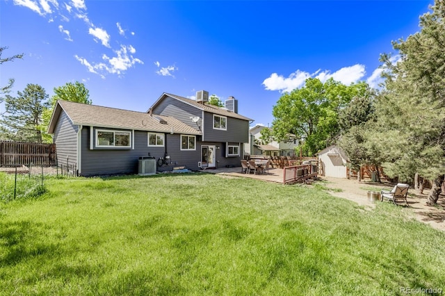 6062 S Newport St, Centennial, CO 80111 - rear view of house with a chimney and cooling unit