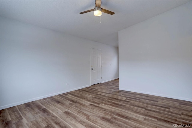 2938 Eliot Cir, Westminster, CO 80030 - spare room with a ceiling fan, wood finished floors, and baseboards