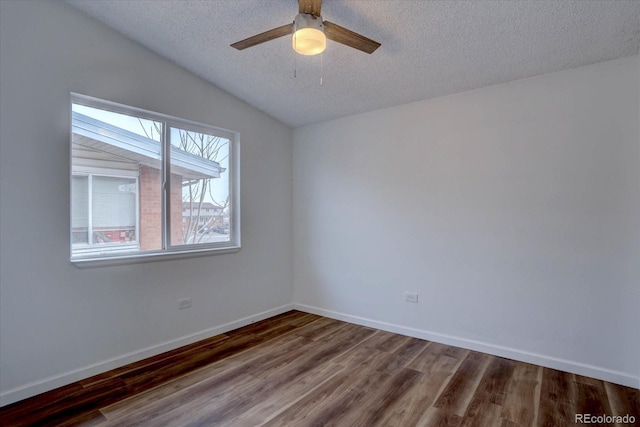 2938 Eliot Cir, Westminster, CO 80030 - unfurnished room with wood finished floors, a textured ceiling, ceiling fan, baseboards, and lofted ceiling