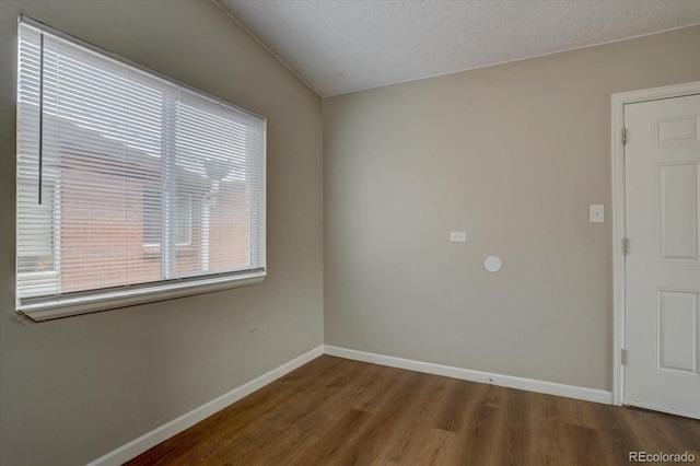 2938 Eliot Cir, Westminster, CO 80030 - unfurnished room featuring wood finished floors, baseboards, and a textured ceiling
