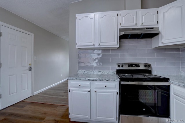 2938 Eliot Cir, Westminster, CO 80030 - kitchen featuring electric range, under cabinet range hood, dark wood-type flooring, and white cabinets