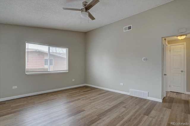 2938 Eliot Cir, Westminster, CO 80030 - empty room with light wood-style floors, a ceiling fan, a textured ceiling, and baseboards