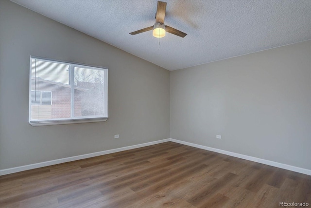 2938 Eliot Cir, Westminster, CO 80030 - empty room with a textured ceiling, wood finished floors, ceiling fan, vaulted ceiling, and baseboards