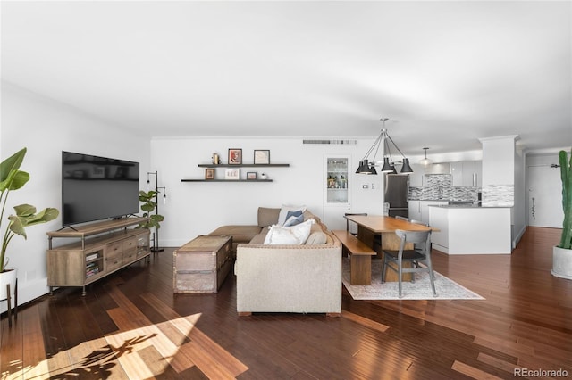 living room with visible vents and hardwood / wood-style floors