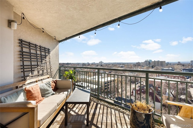 balcony with a city view and an outdoor living space