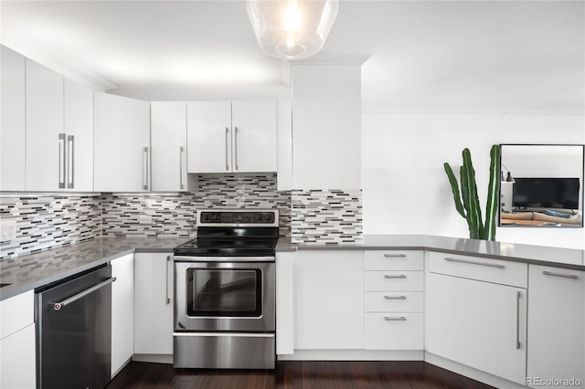 kitchen featuring appliances with stainless steel finishes, white cabinetry, and decorative backsplash