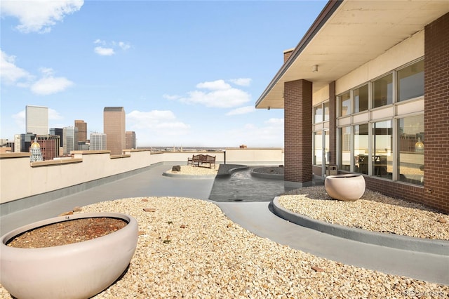 view of patio / terrace with a city view