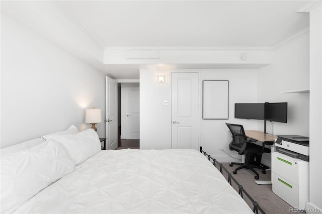 bedroom with carpet floors and crown molding