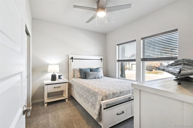 bedroom featuring ceiling fan and dark colored carpet