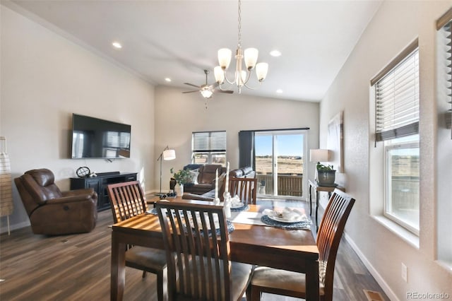 dining area featuring dark hardwood / wood-style flooring, a chandelier, and vaulted ceiling