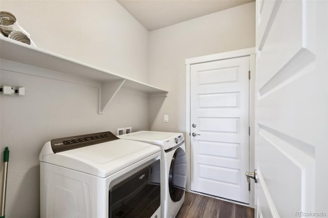 washroom featuring dark hardwood / wood-style flooring and washer and dryer