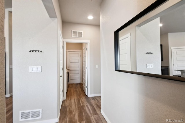 corridor with dark wood-type flooring