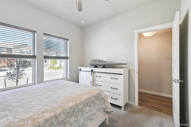 bedroom with ceiling fan and carpet floors