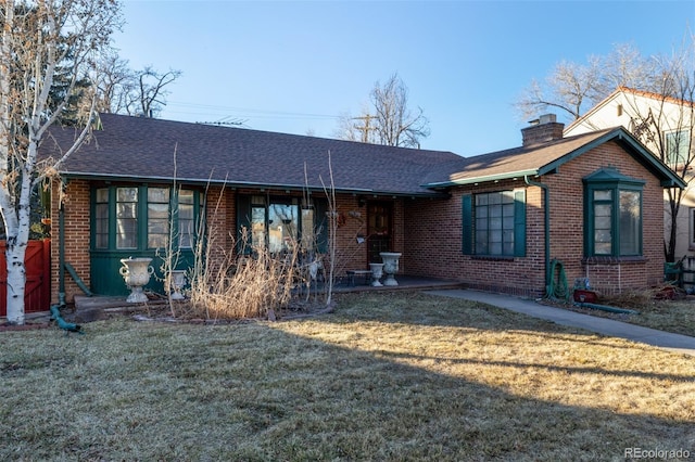 ranch-style house with a front lawn