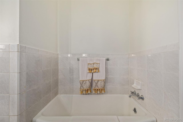 bathroom featuring a tub to relax in