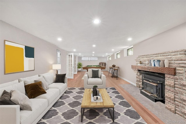 living room with billiards and light hardwood / wood-style flooring