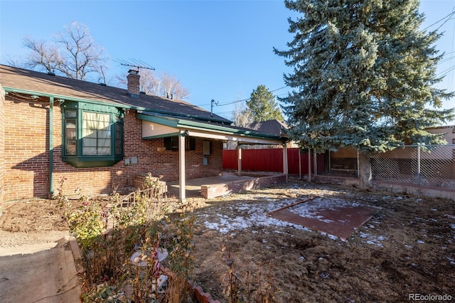 back of house with a patio