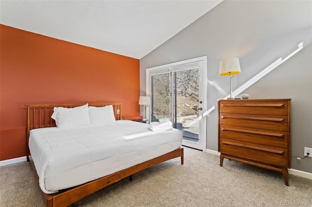470 Bear Creek Rd, Colorado Springs, CO 80906 - bedroom featuring vaulted ceiling, access to exterior, carpet floors, and baseboards