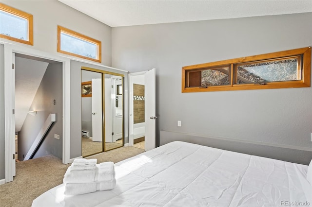 470 Bear Creek Rd, Colorado Springs, CO 80906 - bedroom with carpet floors, a closet, and a baseboard heating unit