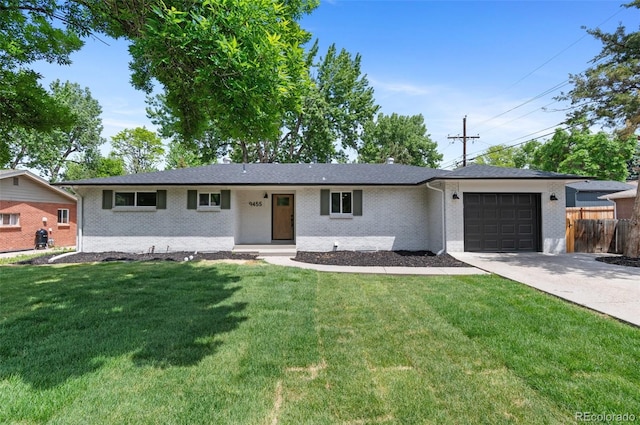 9455 W 37th Ave, Wheat Ridge, CO 80033 - single story home with an attached garage, driveway, and brick siding