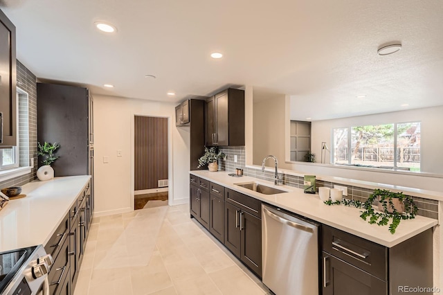 9455 W 37th Ave, Wheat Ridge, CO 80033 - kitchen with appliances with stainless steel finishes, a sink, tasteful backsplash, light countertops, and recessed lighting