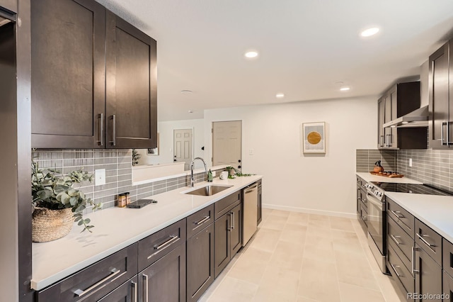 9455 W 37th Ave, Wheat Ridge, CO 80033 - kitchen with a sink, appliances with stainless steel finishes, baseboards, backsplash, and light countertops