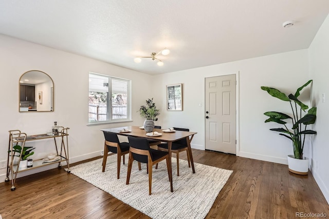 9455 W 37th Ave, Wheat Ridge, CO 80033 - dining area featuring dark wood-type flooring and baseboards