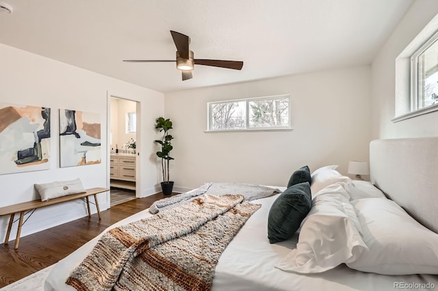 9455 W 37th Ave, Wheat Ridge, CO 80033 - bedroom featuring multiple windows, dark wood-style floors, connected bathroom, and a ceiling fan