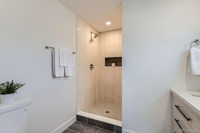 9455 W 37th Ave, Wheat Ridge, CO 80033 - full bathroom featuring baseboards, a tile shower, vanity, toilet, and recessed lighting