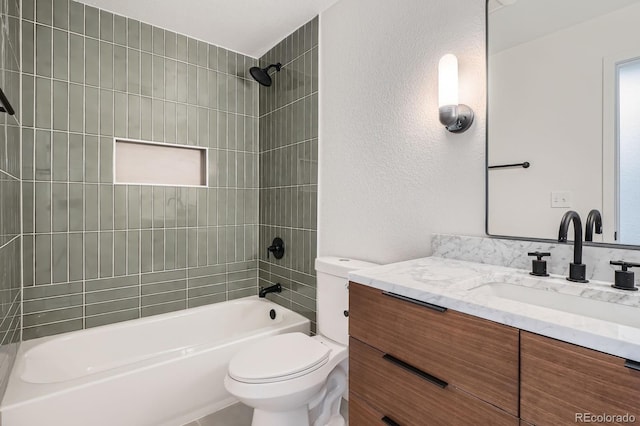 9455 W 37th Ave, Wheat Ridge, CO 80033 - full bath featuring vanity, bathing tub / shower combination, toilet, and a textured wall