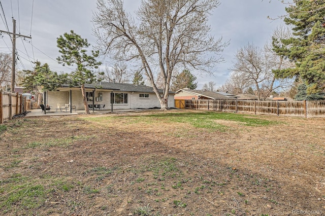 9455 W 37th Ave, Wheat Ridge, CO 80033 - fenced backyard with a patio area