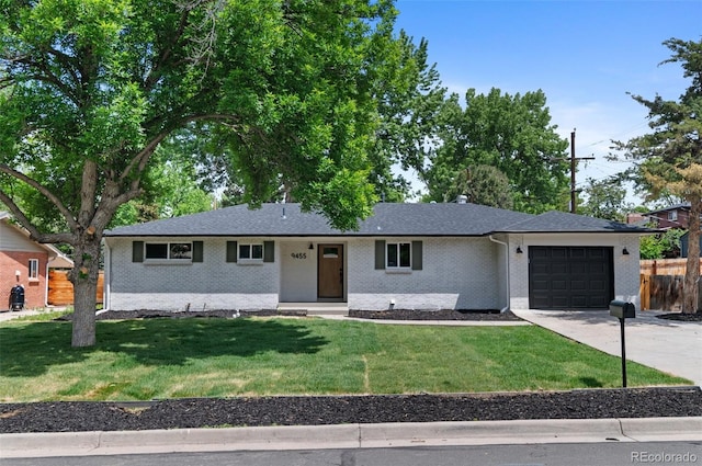 9455 W 37th Ave, Wheat Ridge, CO 80033 - ranch-style house featuring an attached garage, driveway, and brick siding