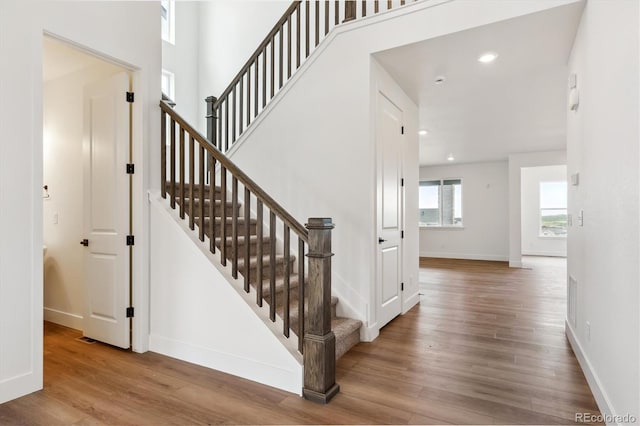 8346 Cokedale Cir, Littleton, CO 80125 - stairway with wood finished floors and recessed lighting