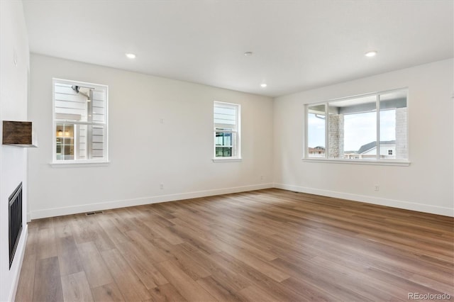 8346 Cokedale Cir, Littleton, CO 80125 - unfurnished living room featuring light wood-style floors and recessed lighting