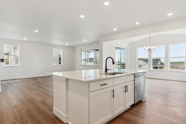 8346 Cokedale Cir, Littleton, CO 80125 - kitchen featuring dishwasher, a center island with sink, light wood-type flooring, healthy amount of natural light, and recessed lighting