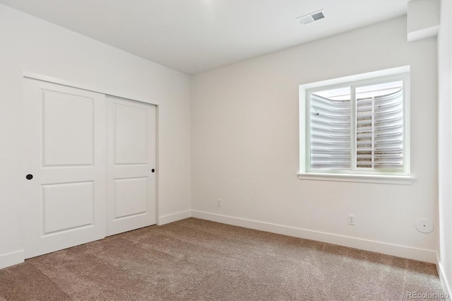 8346 Cokedale Cir, Littleton, CO 80125 - unfurnished bedroom featuring light carpet and a closet