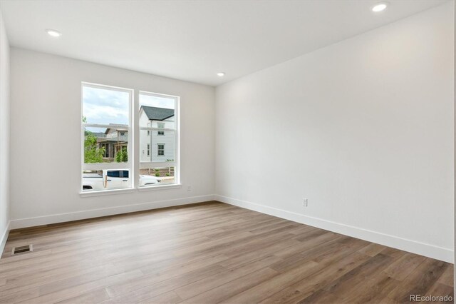 8346 Cokedale Cir, Littleton, CO 80125 - spare room featuring light wood-style floors and recessed lighting