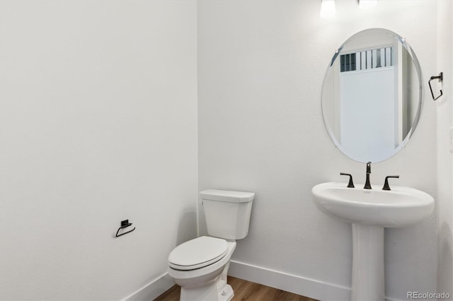 8346 Cokedale Cir, Littleton, CO 80125 - half bath with baseboards and wood finished floors