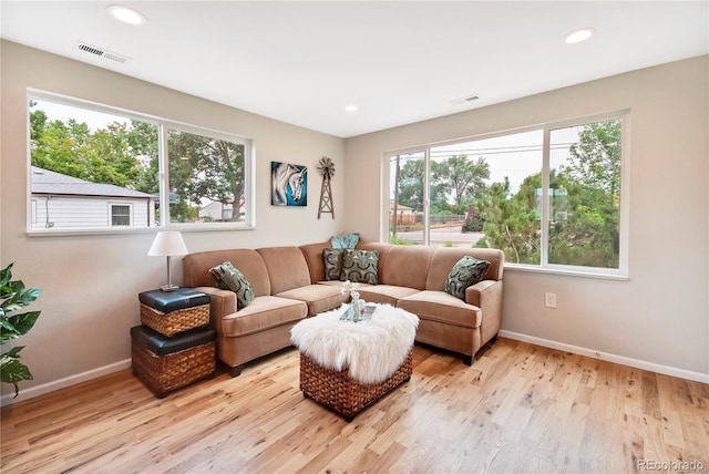 6245 W 53rd Ave, Arvada, CO 80002 - living area featuring baseboards, light wood-type flooring, and recessed lighting