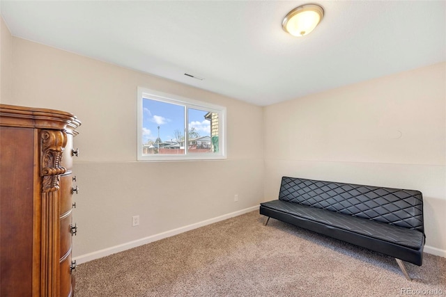 3516 Marigold St, Evans, CO 80620 - living area with carpet floors, baseboards, and visible vents