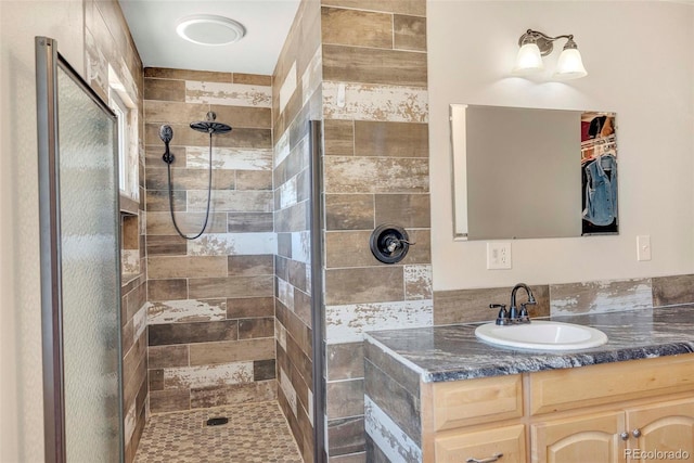 3516 Marigold St, Evans, CO 80620 - bathroom featuring vanity and a tile shower
