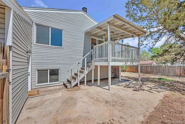 3516 Marigold St, Evans, CO 80620 - back of property with a patio, fence, a wooden deck, and stairs