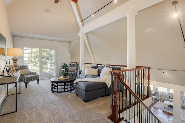 17575 E Kettle Pl, Centennial, CO 80016 - living room featuring track lighting, beamed ceiling, ornate columns, high vaulted ceiling, and carpet flooring