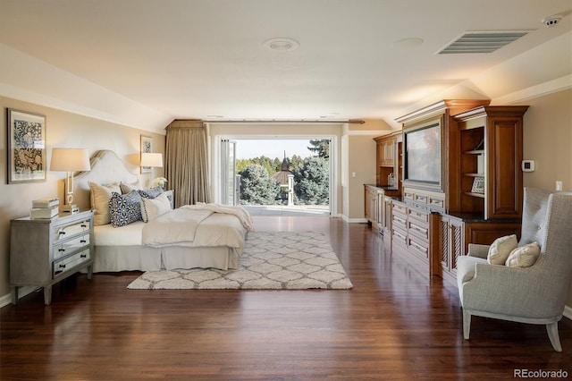 bedroom with dark hardwood / wood-style floors and vaulted ceiling